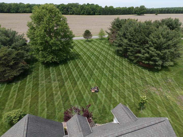 Aerial view of a large lawn mowed in a diamond pattern